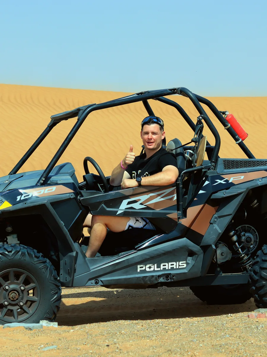 Dune buggy convoy on Dubai red dunes