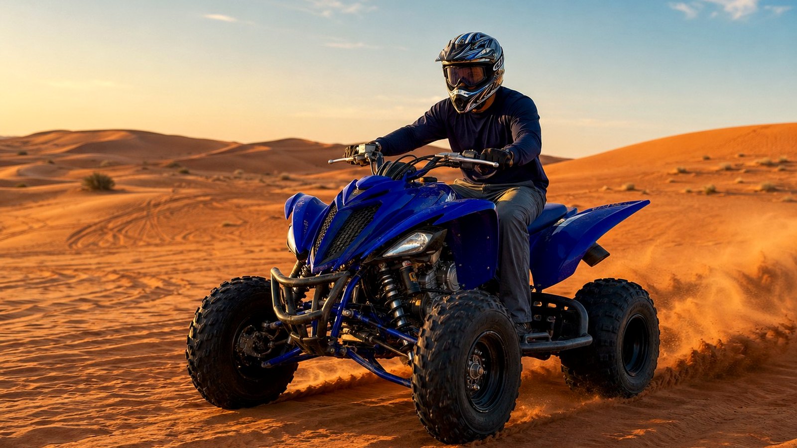 Quad biking Dubai rider on red desert dunes